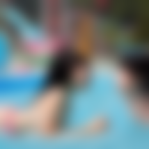 two preteens japanese girl kissing in water park 